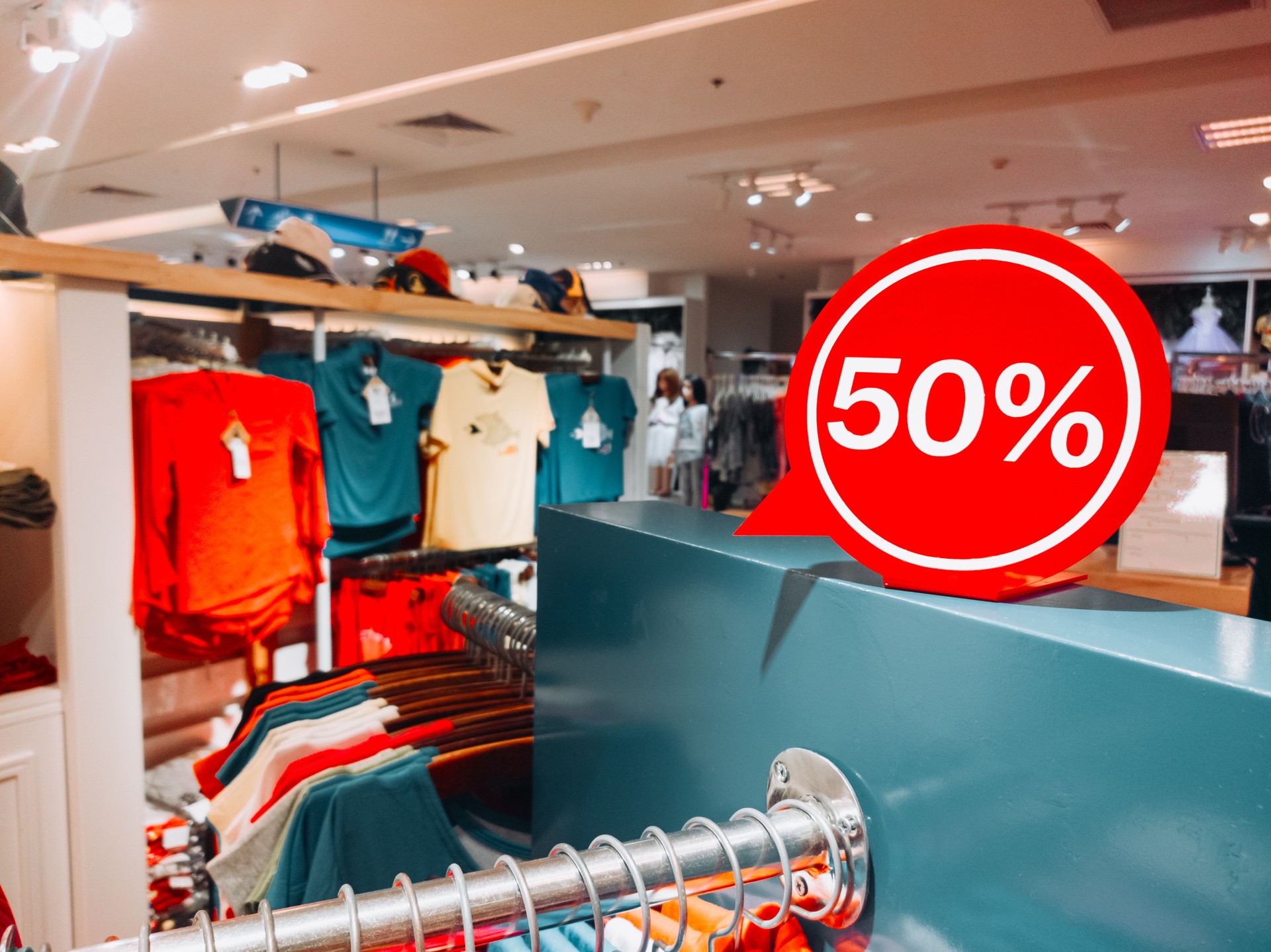 Shopping Sale T-shirts -50% discount. Sales in the male and female closing section (shirts). Horizontal copyspace